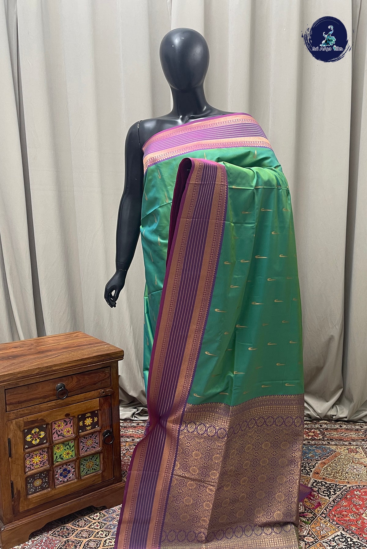 Bluish Green Semi Silk Saree With Zari Buttas Pattern