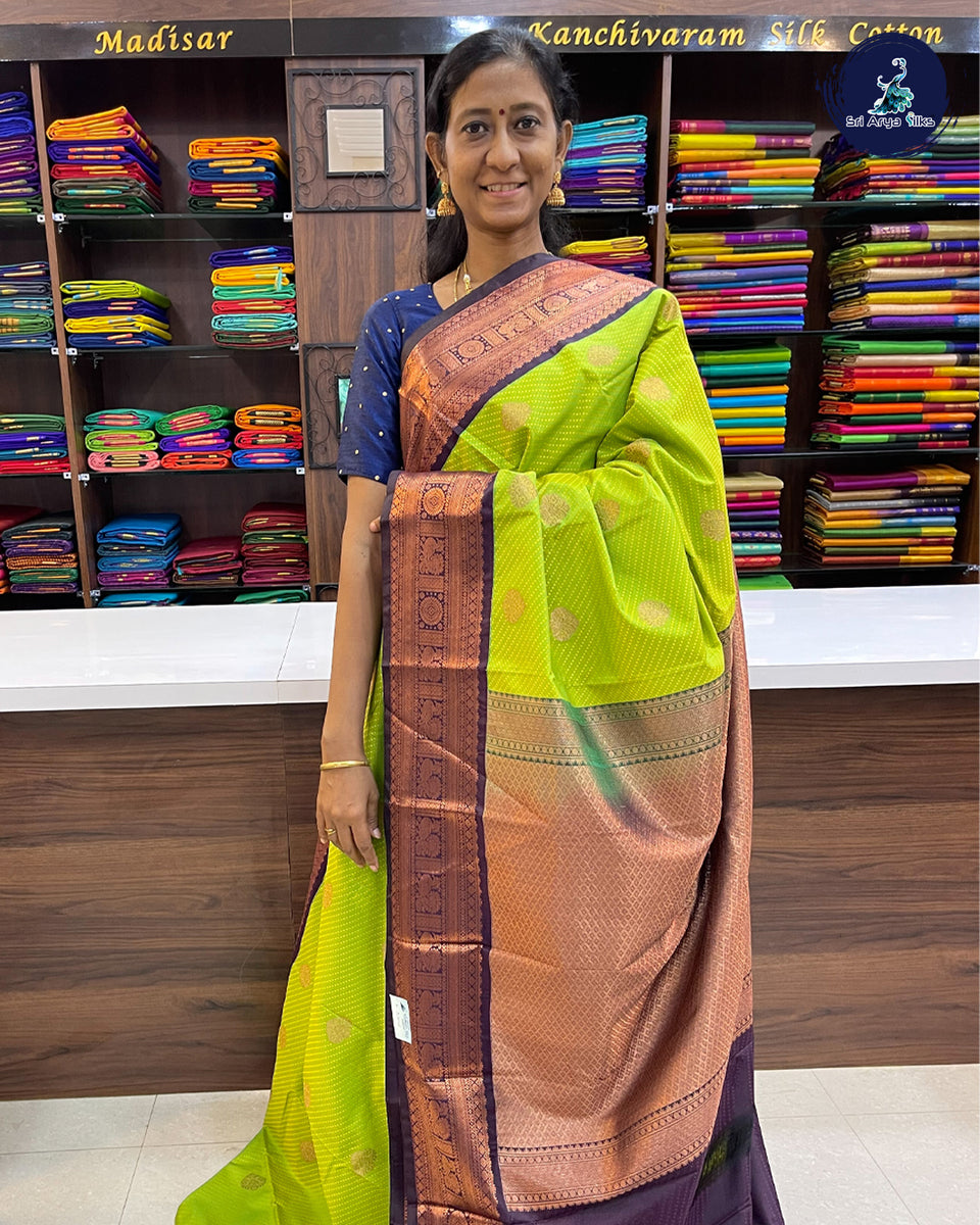 Navy Blue Coloured Kanchipuram Silk Saree With Contrast Peach Pink Blouse.