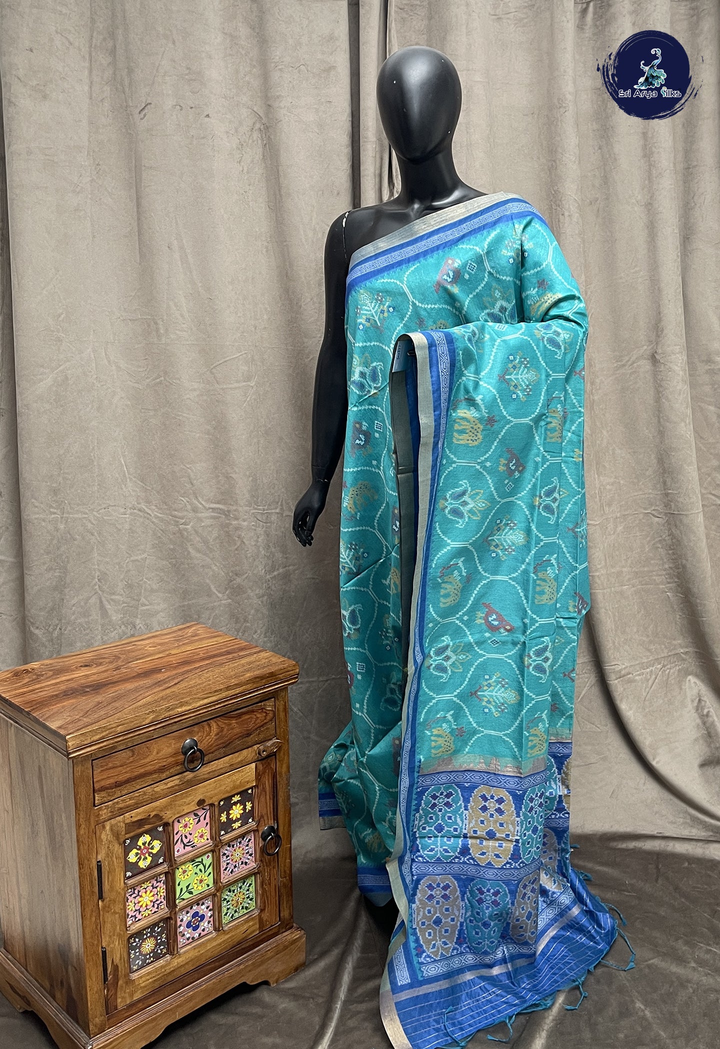 Teal Semi Raw Silk Saree With Ikat Pattern