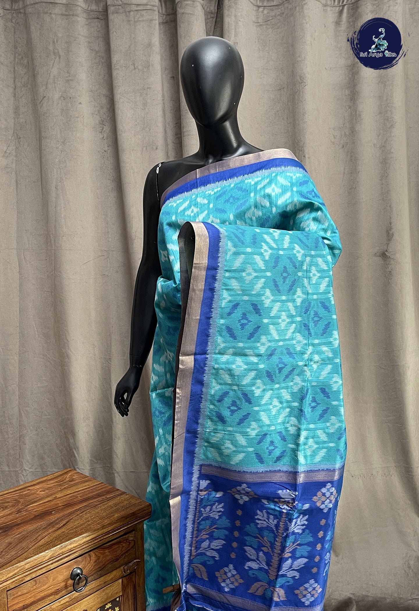Teal Blue Semi Raw Silk Saree With Ikat Pattern