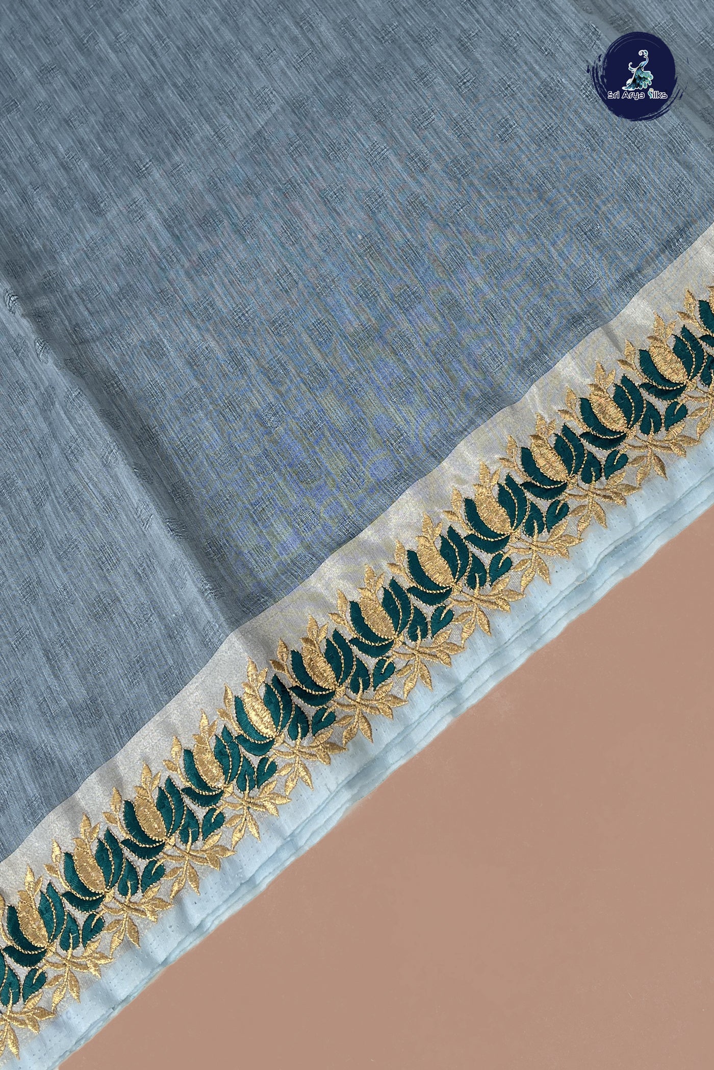 Blue Semi Raw Silk Saree With Embossed Pattern