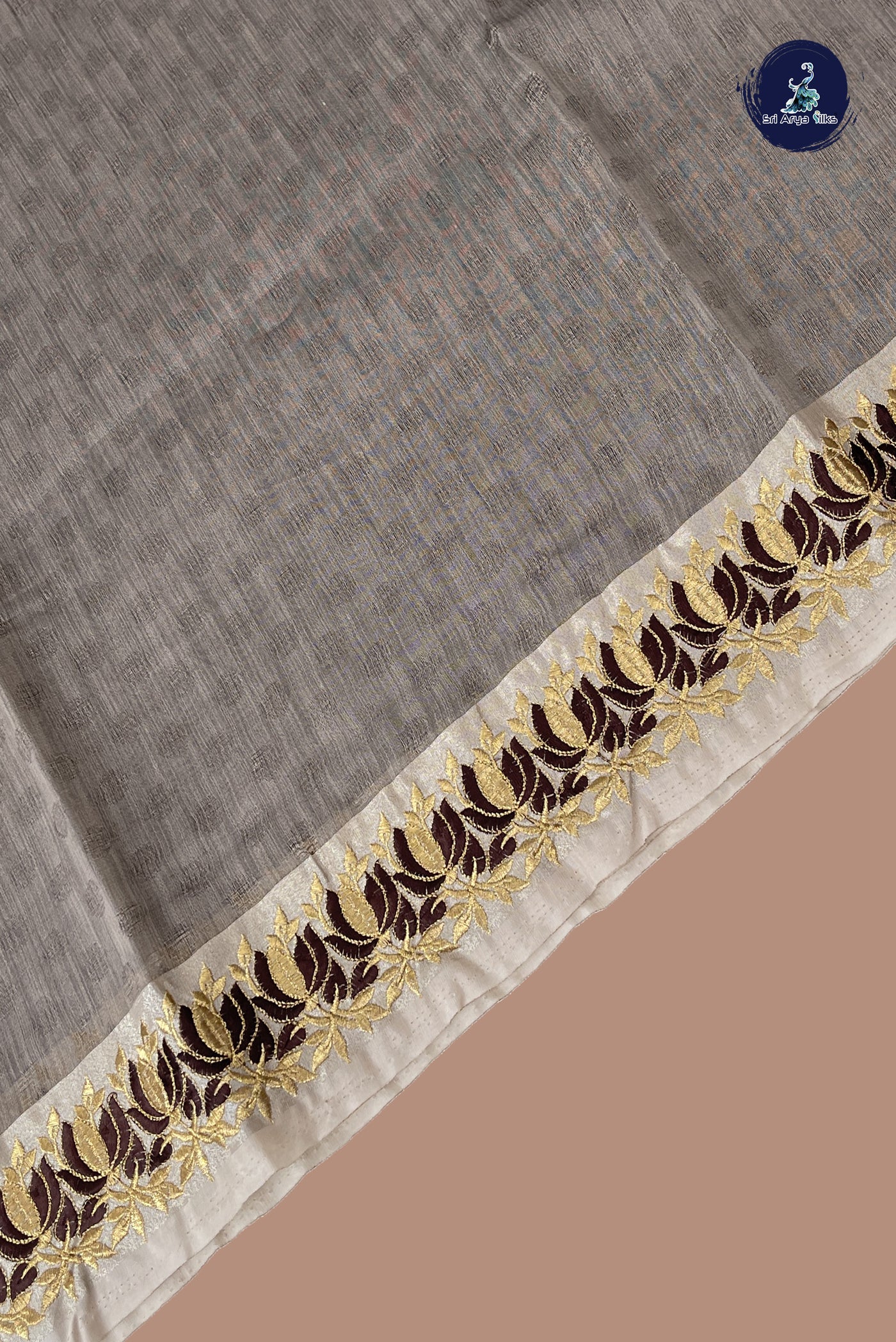 Chocolate Shade Semi Raw Silk Saree With Embossed Pattern