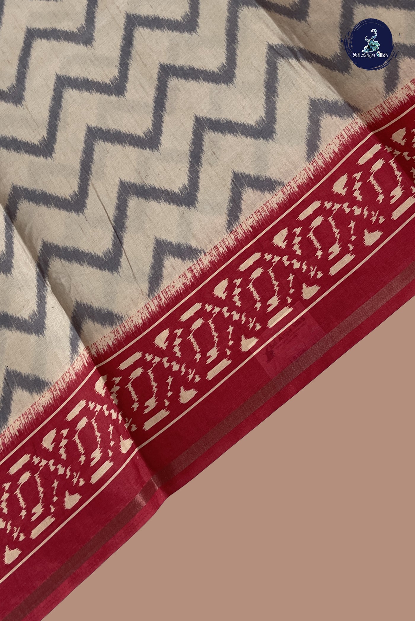 Biscuit Shade Semi Grape Silk Saree With Ikat Pattern