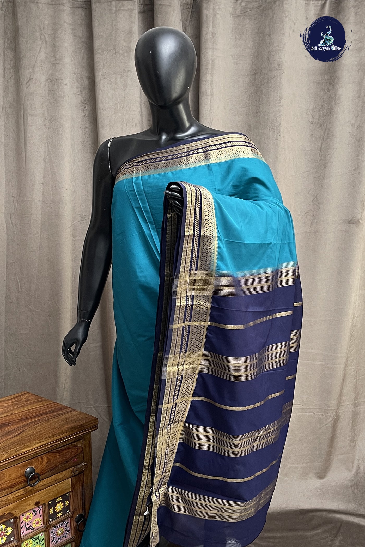 Peacock Blue Semi Mysore Silk With Plain Pattern