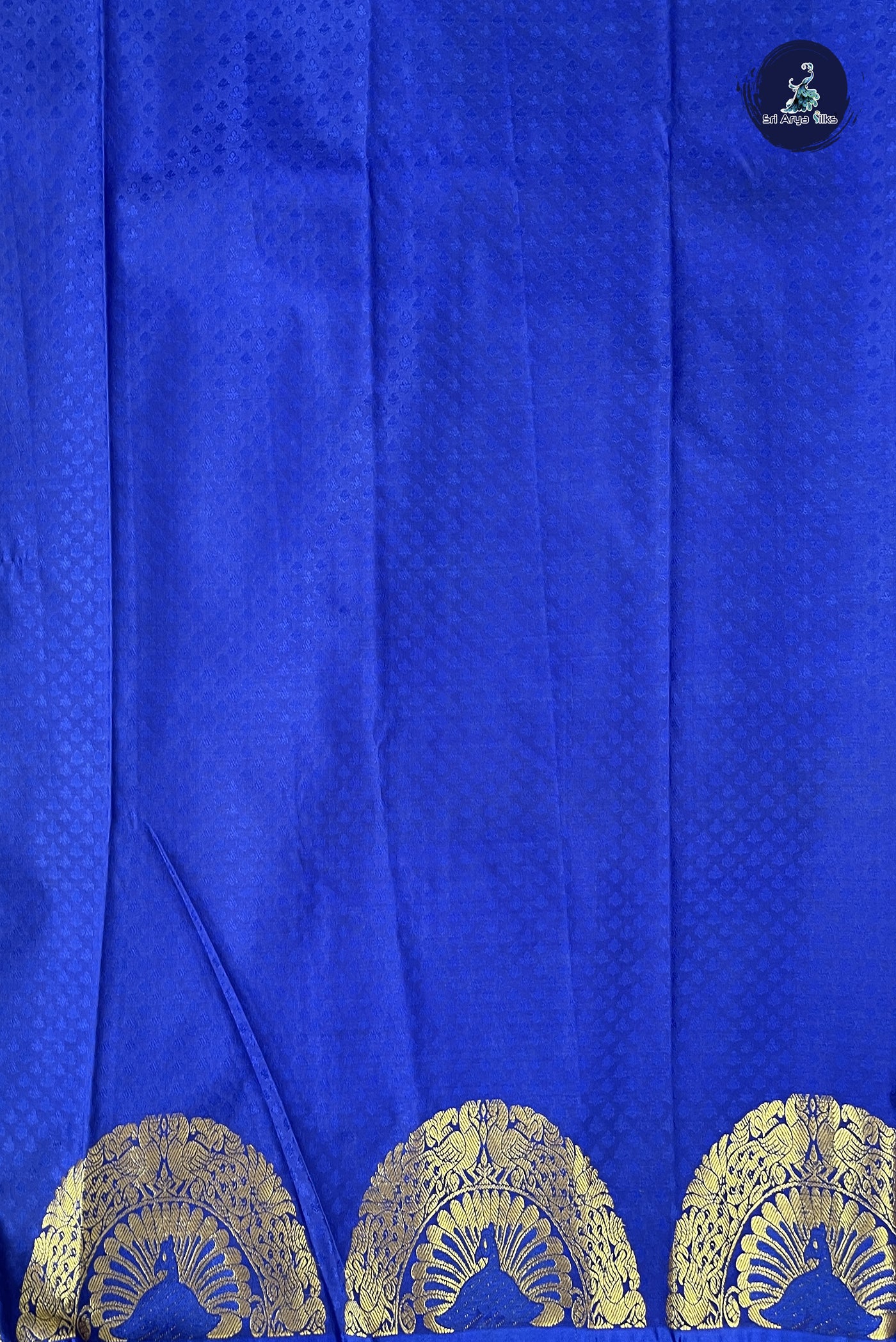 Green Semi silk saree with embossed pattern