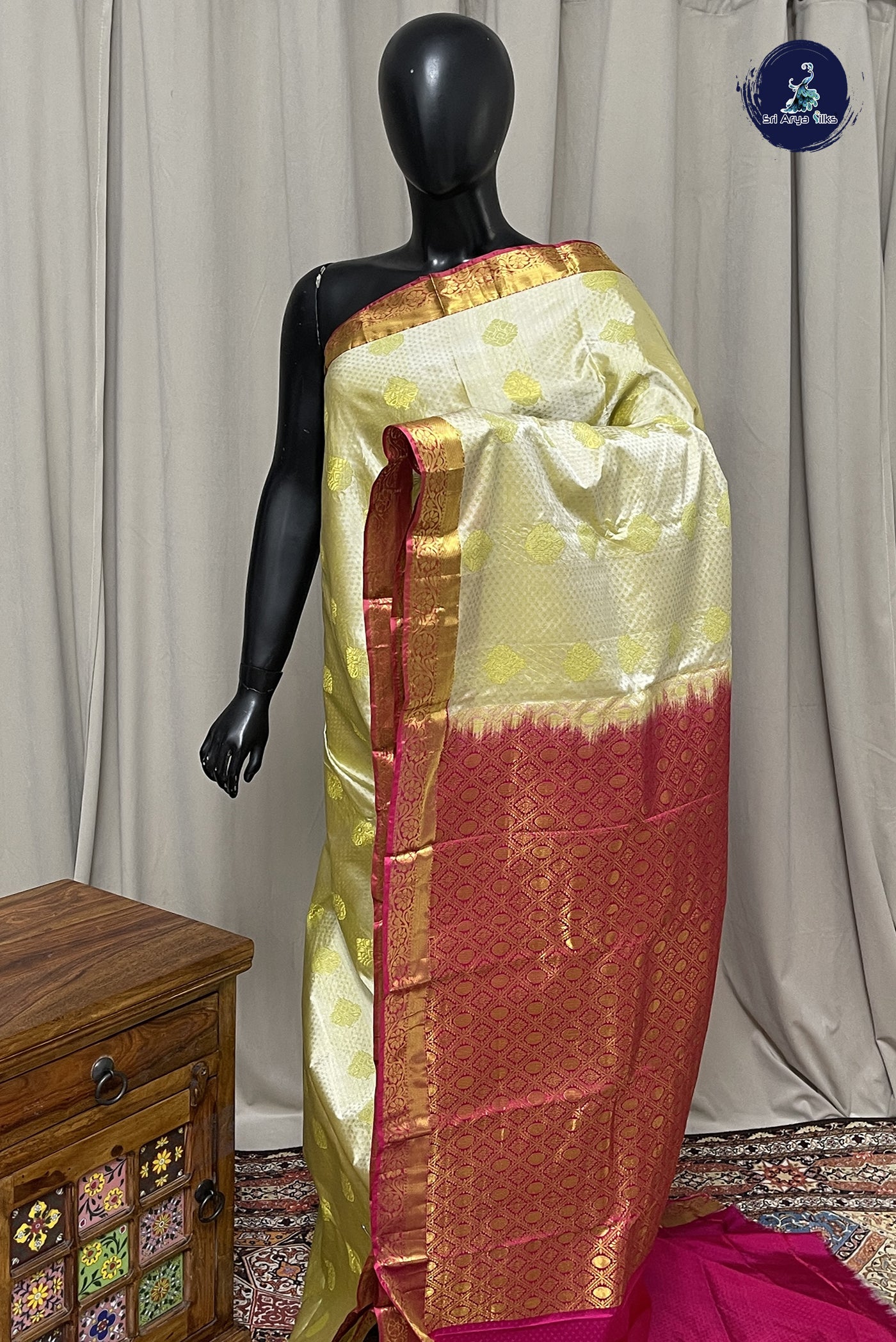 Creamish Yellow Semi Silk Saree With Zari Buttas Pattern