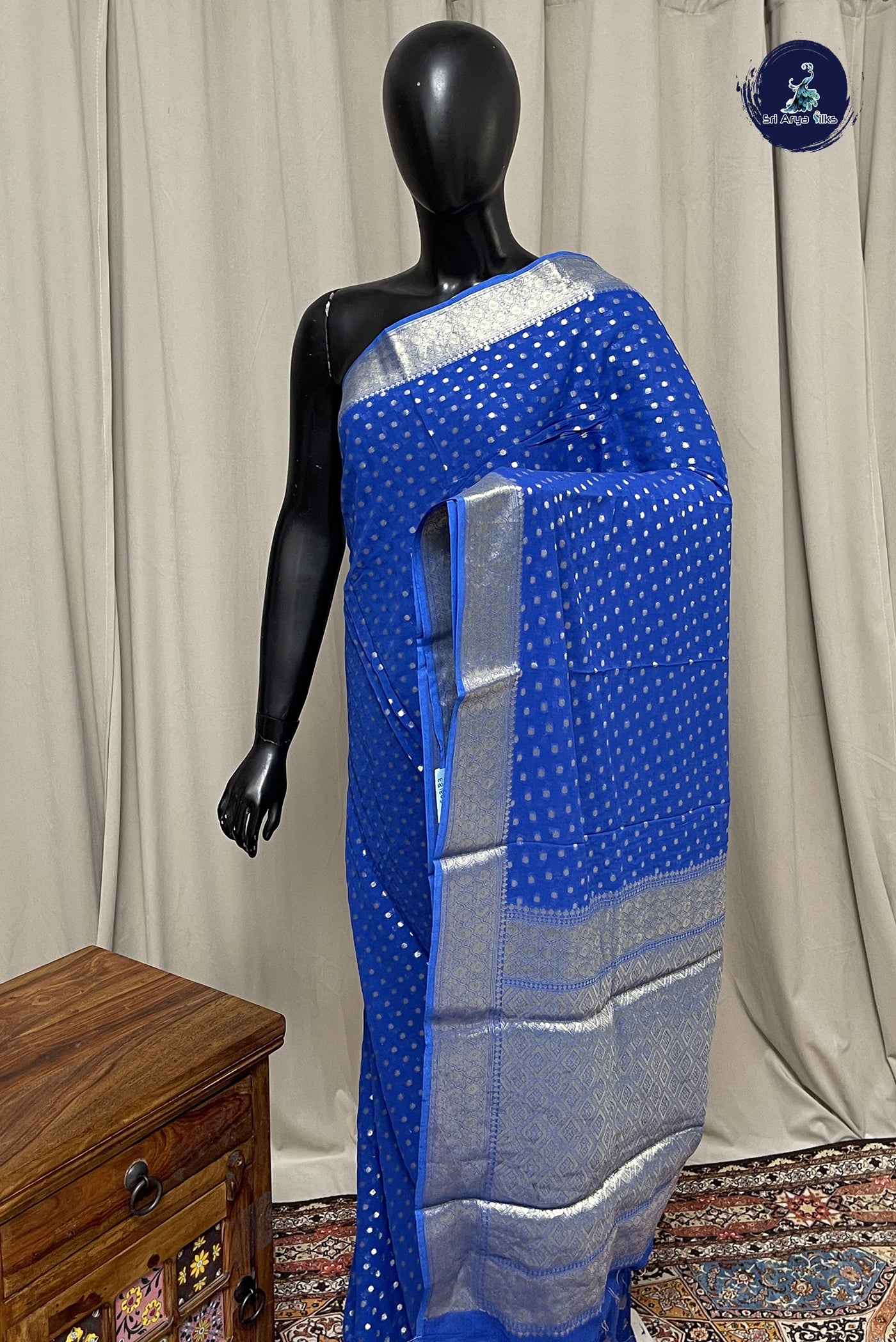 Blue Chiffon Saree With Zari Buttas Pattern