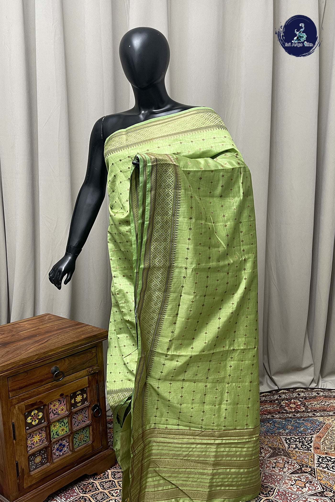 Light Green Semi Tussar Saree With Copper Zari Buttas Pattern