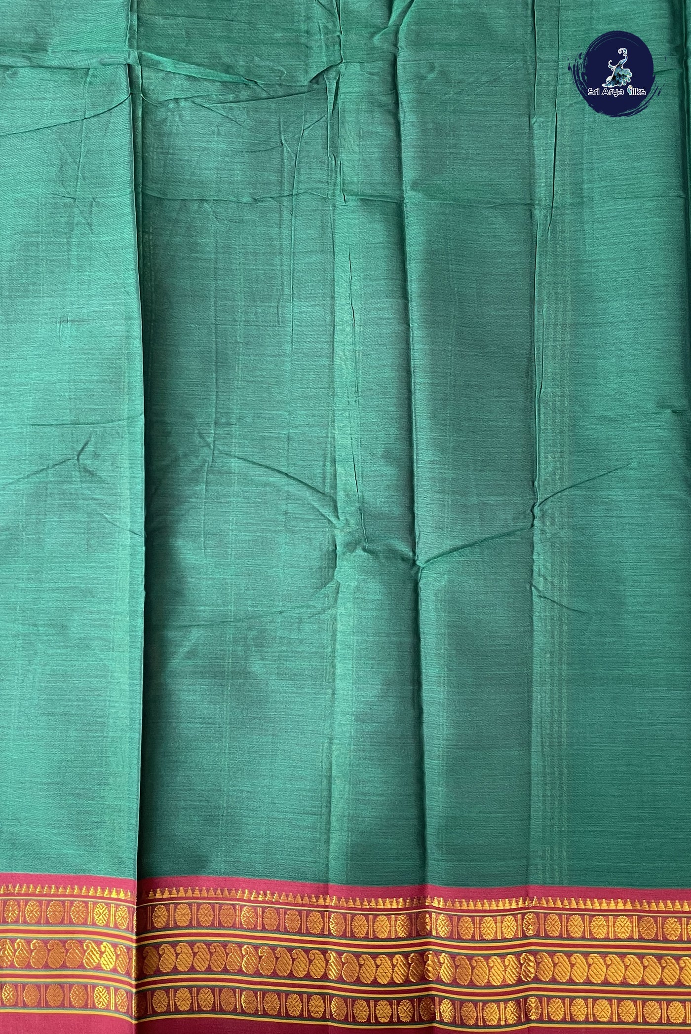 Bottle Green Budget Semi Silk Cotton Saree With Plain Pattern