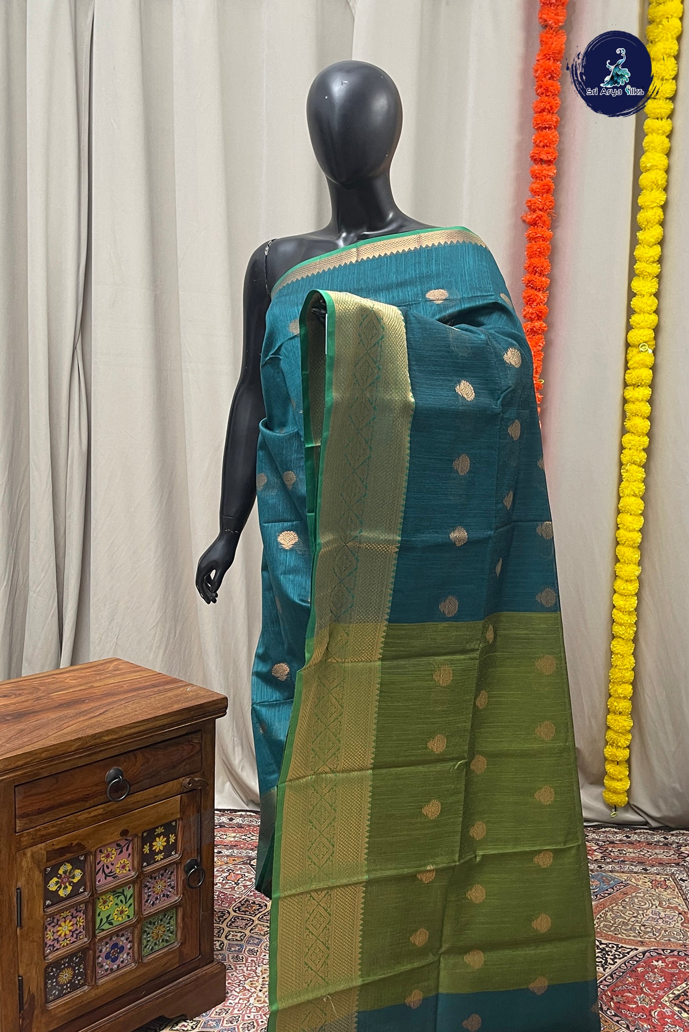 Peacock Blue Raw Silk Saree With Zari Buttas Pattern