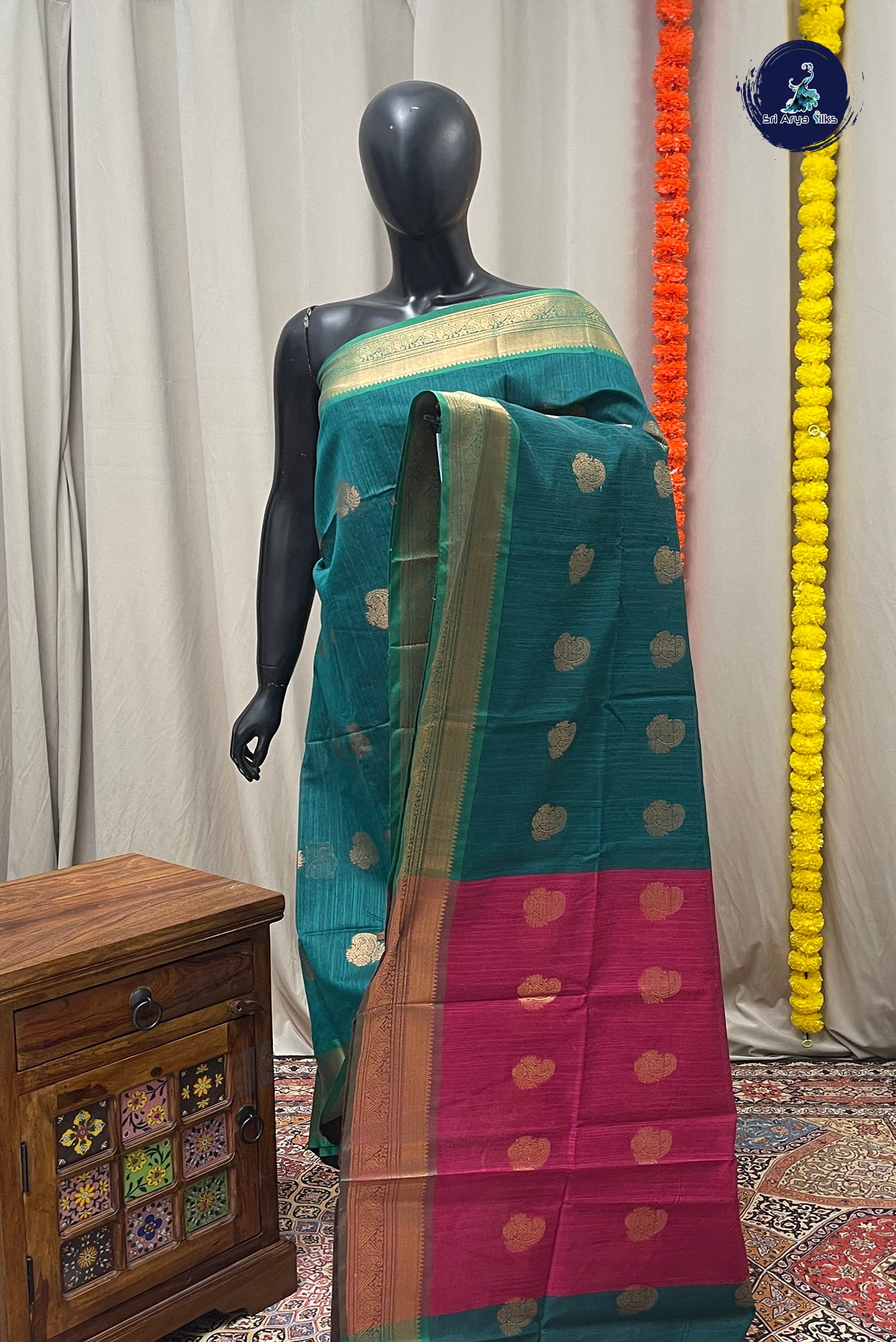 Peacock Blue Raw Silk Saree With Zari Buttas Pattern