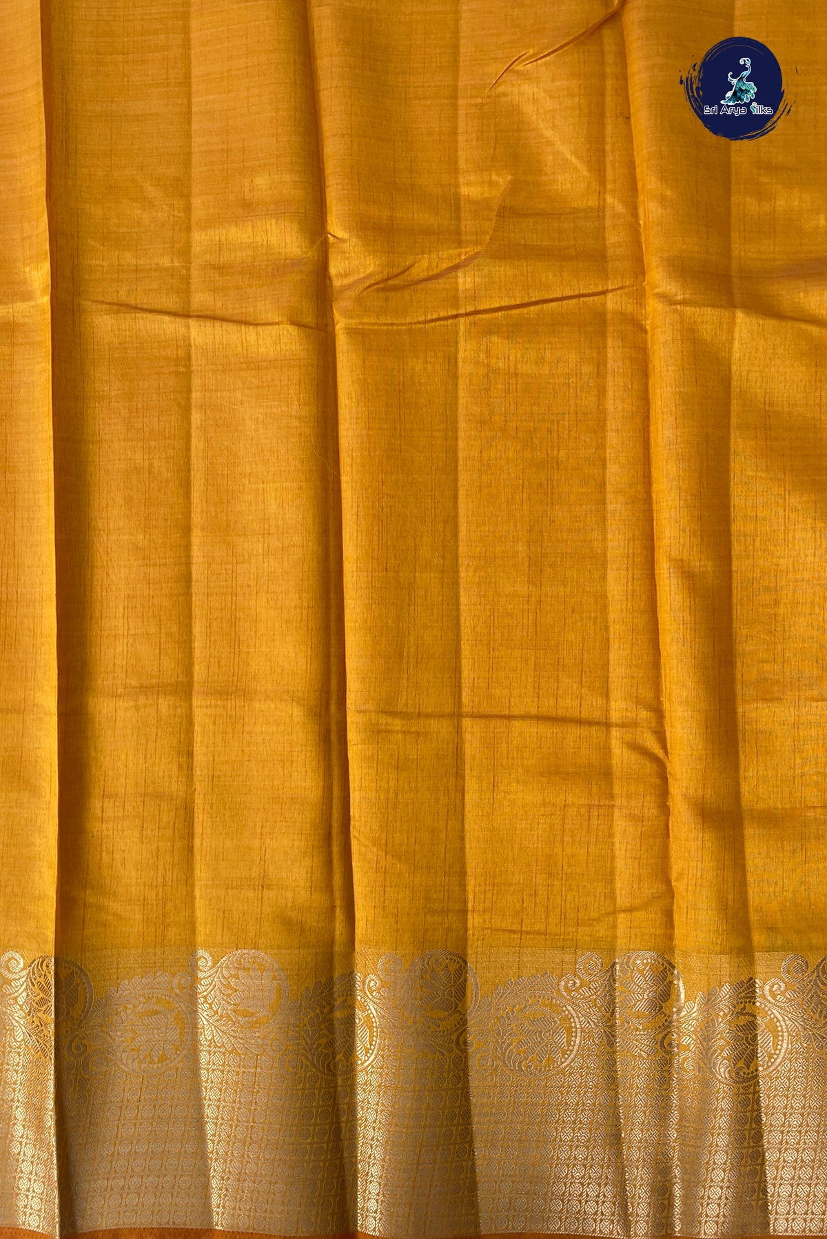 Lite Mustard Orange Semi Tussar Saree With Plain Pattern
