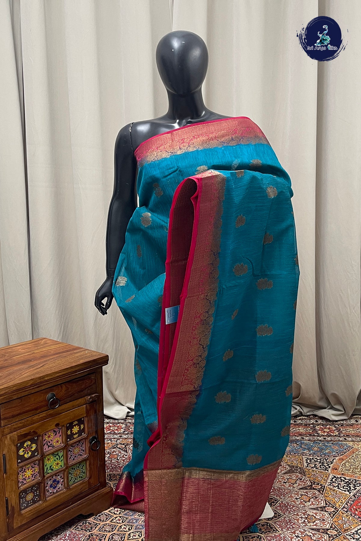 Teal Blue Raw Silk Saree With Zari Buttas Pattern