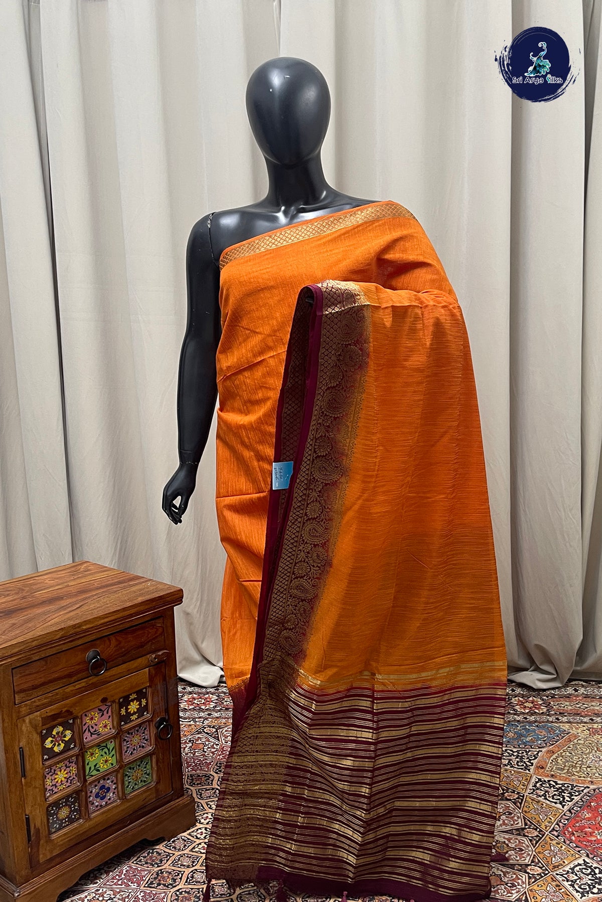 Lite Mustard Orange Raw Silk Saree With Plain Pattern