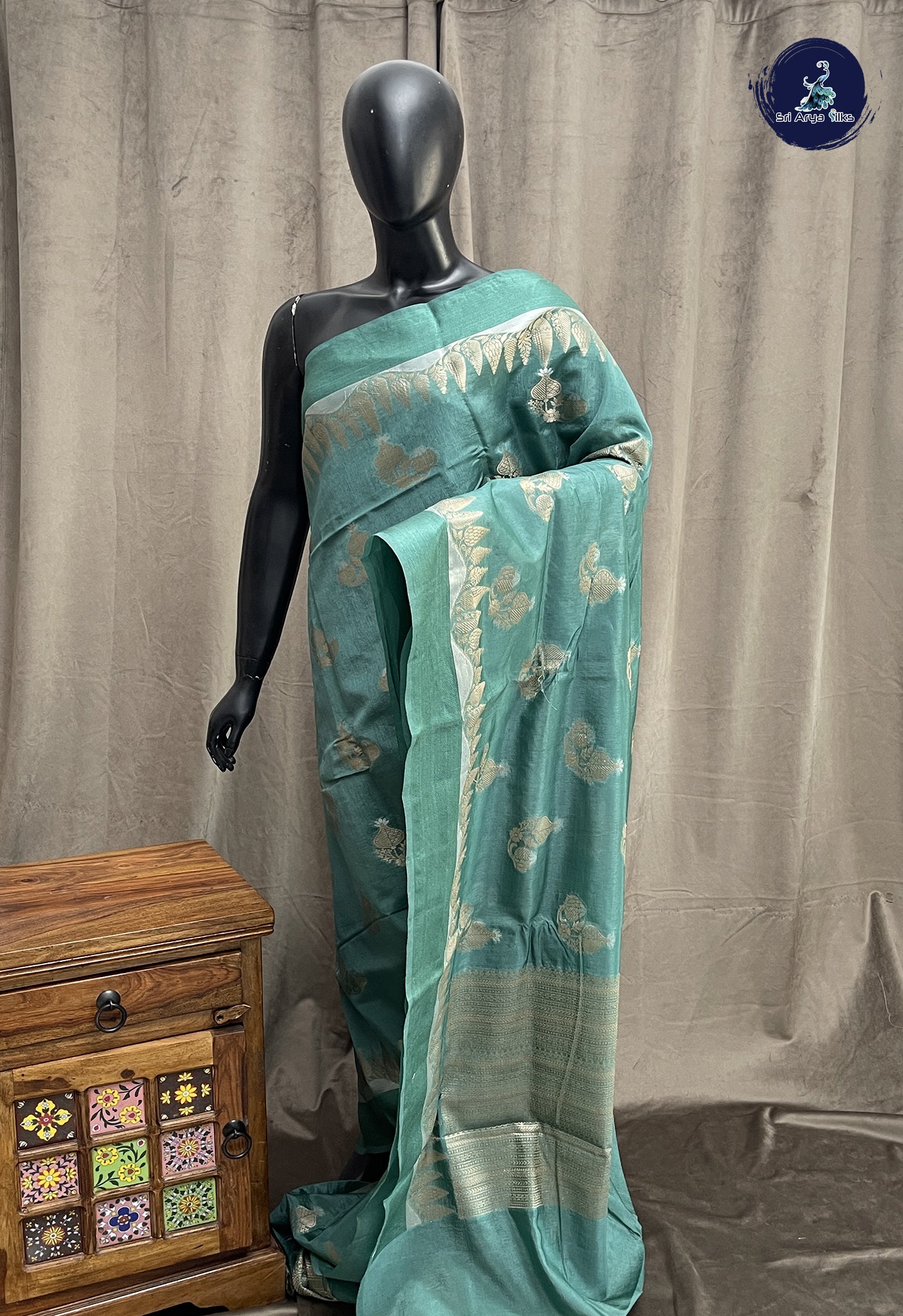 Emerald Green Semi Raw Silk Saree With Zari Buttas Pattern