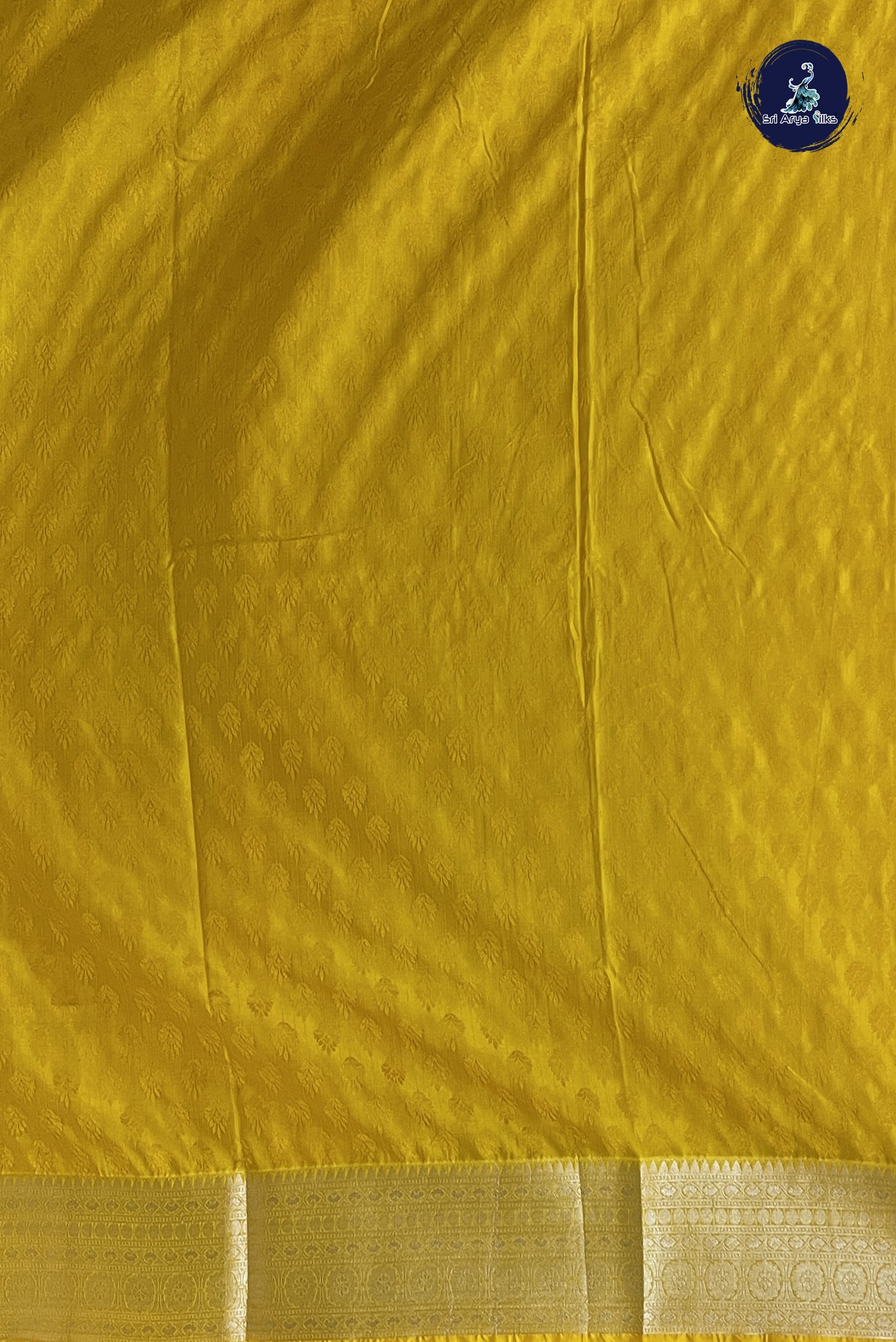 Yellow Semi Raw Silk Saree With Embossed Pattern