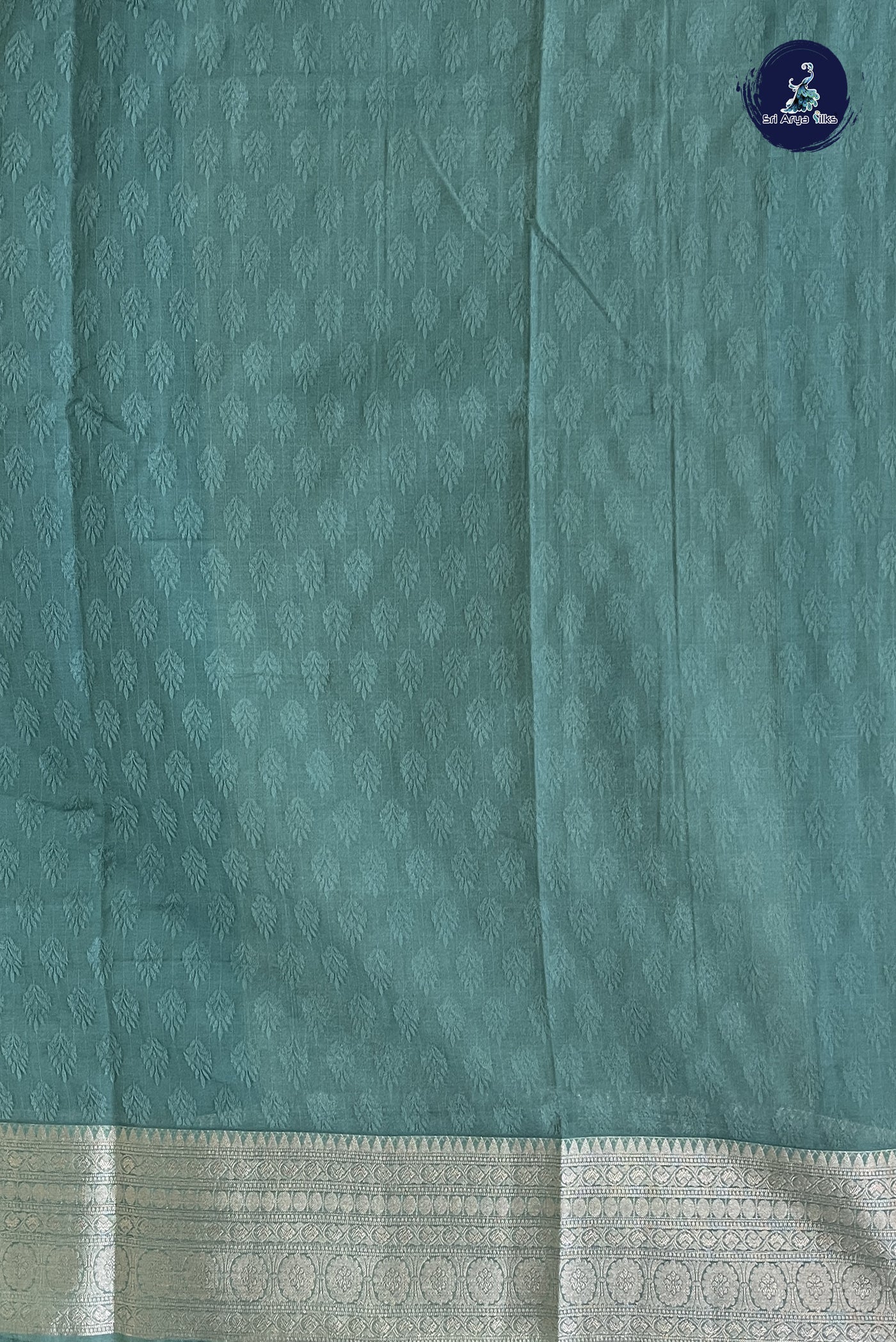 Emerald Green Semi Raw Silk Saree With Embossed Pattern